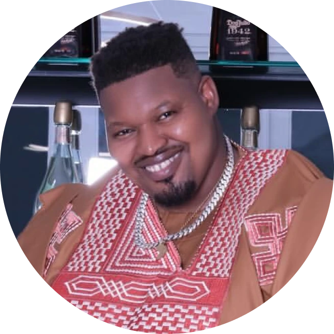 Smiling man in patterned robe and necklace