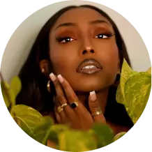 Close-up of woman with glossy lips and rings