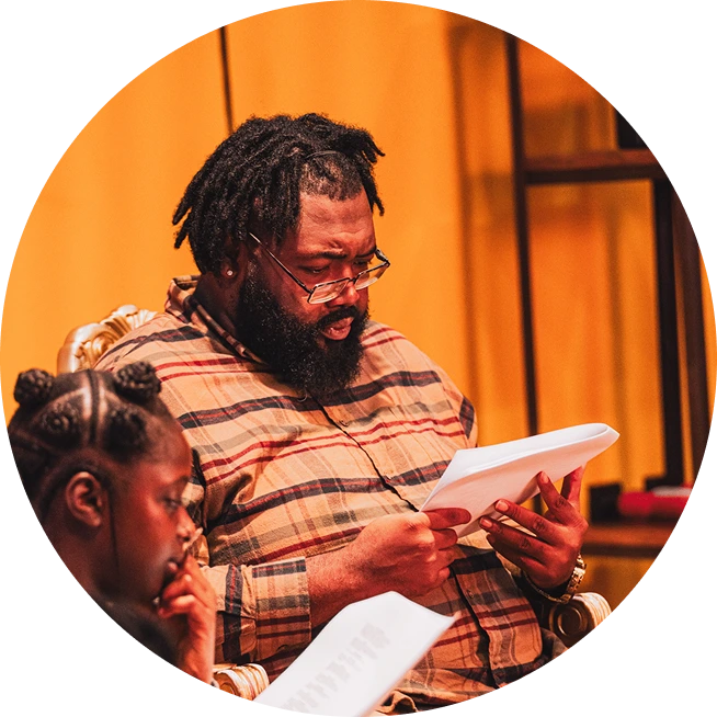 Bearded man and girl reading scripts