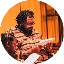 Person reading script during rehearsal